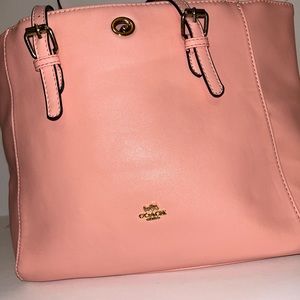Pink coach bag , wallet not included .